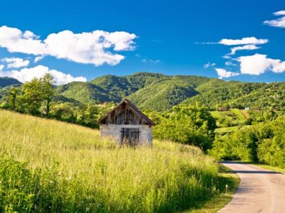Landscape of green Zumberak hills with old stone cottage, northern Croatia